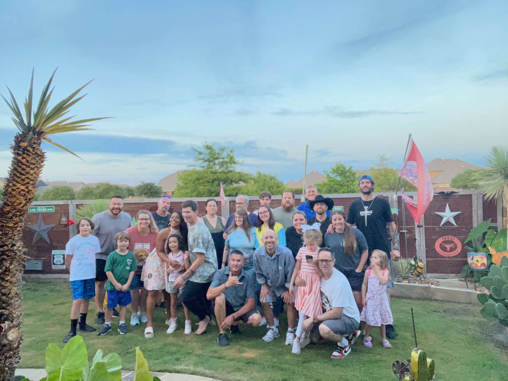 Families gathered in a backyard for a family night