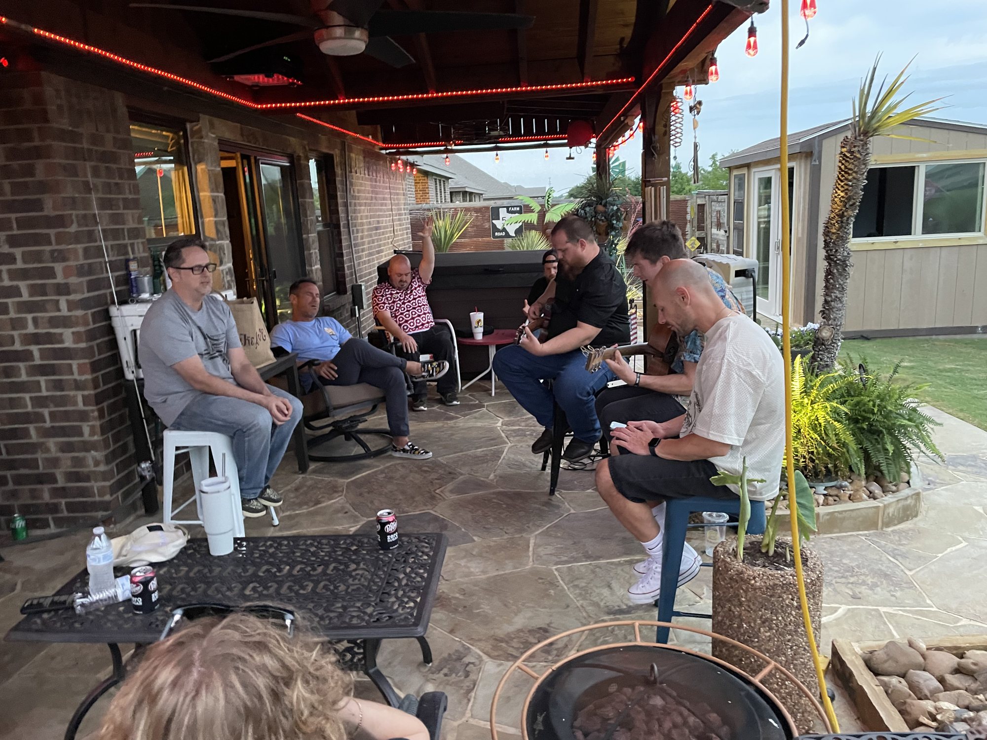 Men gathered on a patio for fellowship